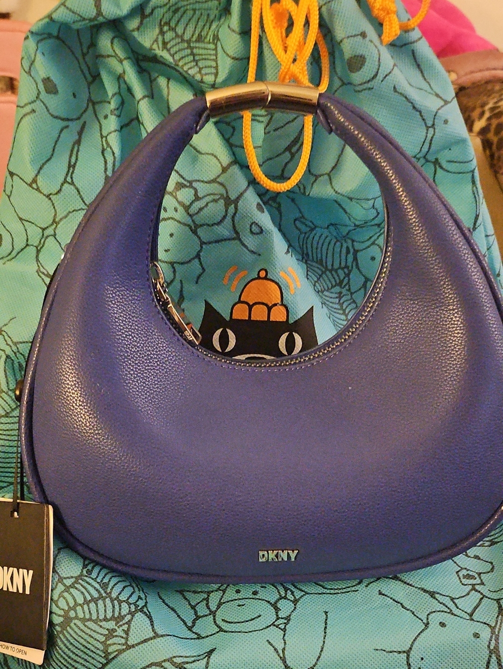 DKNY Blue Crescent Shoulder Bag with Metal Handle Accent